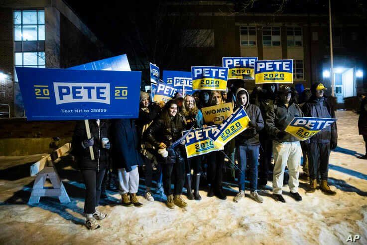 Supporters of Democratic presidential candidate former South Bend, Ind., Mayor Pete Buttigieg gather outside a polling place…