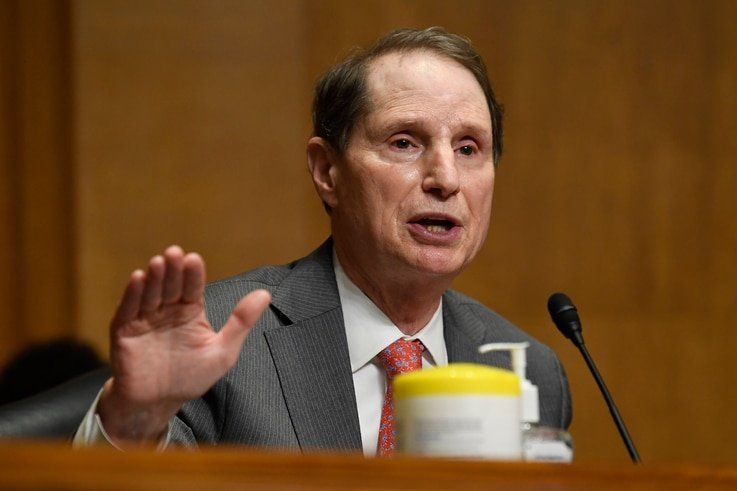 Sen. Ron Wyden, D-Ore., questions Internal Revenue Service Commissioner Charles Rettig at a Senate Finance Committee hearing on…
