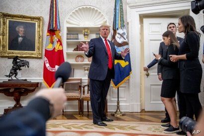 President Donald Trump stops to take a question from the press, as he departs a ceremonial swearing-in ceremony for new Labor Secretary Eugene Scalia in the Oval Office of the White House in Washington, Sept. 30, 2019.