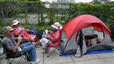 Fans, Protesters Line Up for Trump’s Re-election Rally