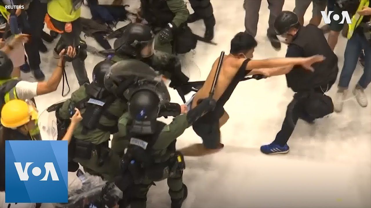 Riot Police Clash with Protesters Inside Hong Kong Mall