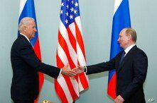 FILE - In this March 10, 2011, file photo, Vice President of the United States Joe Biden, left, shakes hands with Russian Prime…