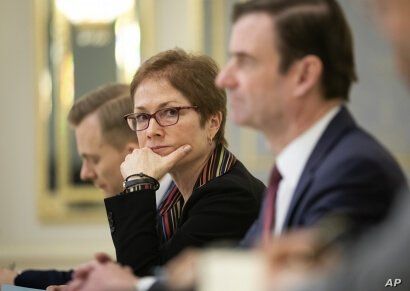 U.S. Ambassador to Ukraine Marie Yovanovitch, center, sits during her meeting with Ukrainian President Petro Poroshenko in Kyiv, Ukraine, March 6, 2019. Yovanovitch directed unusually scathing criticism at the Ukrainian government in remarks released...