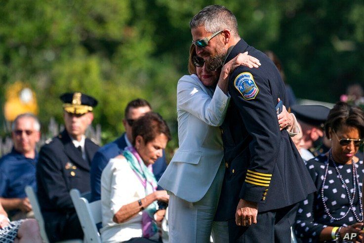 Speaker of the House Nancy Pelosi of Calif., hugs Washington Metropolitan Police Department officer Michael Fanone before an…