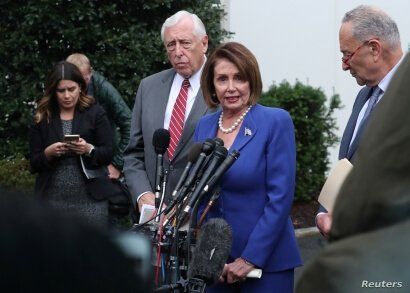 U.S. House Speaker Nancy Pelosi (D-CA) walks out with Senate Minority Leader Chuck Schumer (D-NY) and House Majority Leader Steny Hoyer (D-MD) to speak with reporters after meeting with President Trump at the White House in Washington, Oct. 16, 2019.