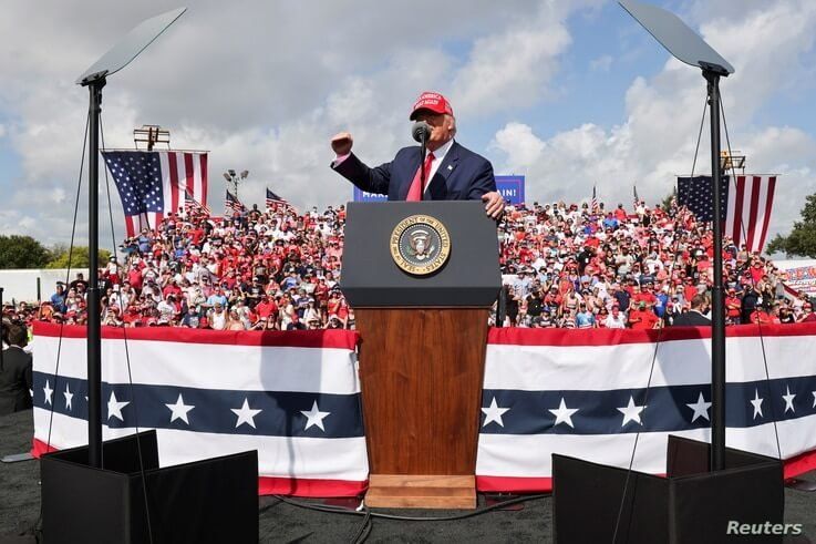 U.S. President Donald Trump gestures as he speaks during a campaign rally outside Raymond James Stadium, in Tampa, Florida.