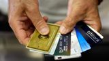 U.S. credit card debt rises to average of more than $10,000 per household, report shows