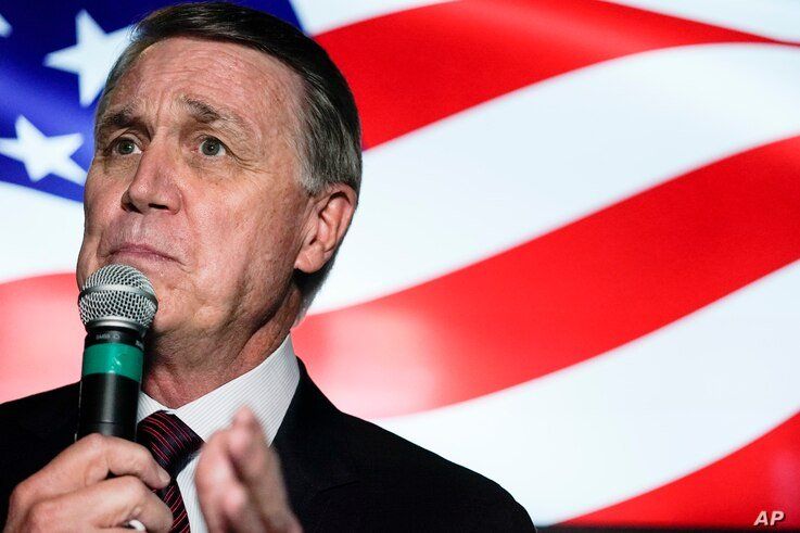 FILE - In this Friday, Nov. 13, 2020 file photo, candidate for U.S. Senate Sen. David Perdue speaks during a campaign rally, in…