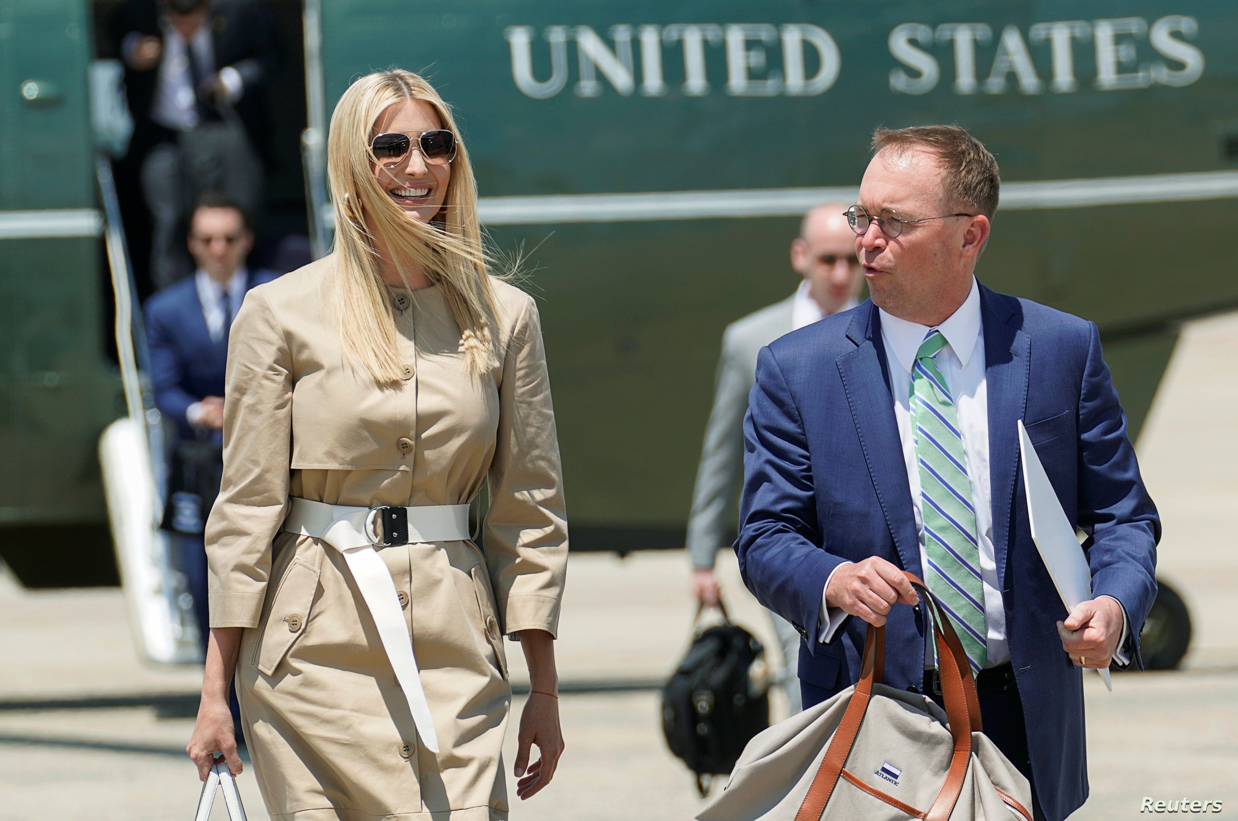 White House senior adviser Ivanka Trump and Acting White House Chief of Staff Mick Mulvaney walk from the Marine One helicopter as they depart Washington for travel to the G-20 summit in Osaka, Japan, from Joint Base Andrews, Maryland, June 26, 2019. 
