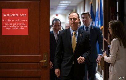 House Intelligence Committee Chairman Adam Schiff, D-Calif., followed by Rep. Jamie Raskin, D-Md., left, and Rep. Eric Swalwell…