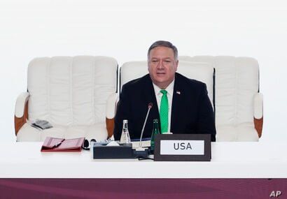 U.S. Secretary of State Mike Pompeo talks at the opening session of peace talks between the Afghan government and the Taliban, in Doha, Qatar, Sept. 12, 2020.