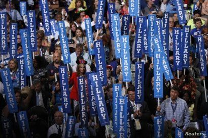Delegates hold Hillary Clinton signs at the Democratic National Convention in Philadelphia, Pennsylvania, July 28, 2016.