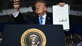 President Donald Trump signs executive order to bring down diesel costs during Nebraska rally