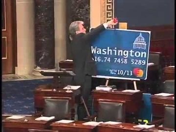 Sen. Tom Coburn cuts up giant credit card on the Senate floor