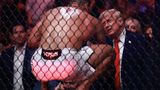 UFC fighter Paulo Costa jumps out of cage to greet Trump at match