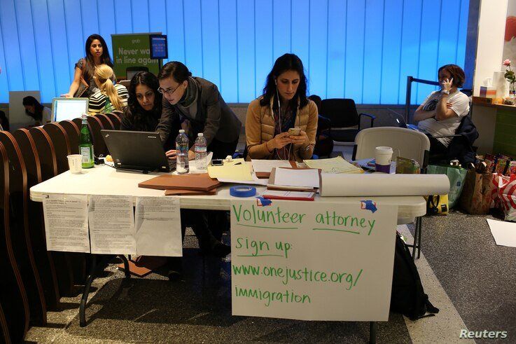 Volunteer immigration attorneys organize to help as people gather to protest against President Donald Trump's executive order travel ban at Los Angeles International Airport, Jan. 31, 2017.