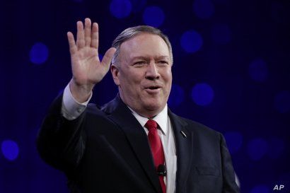 Secretary of State Mike Pompeo waves the crowd before speaking at the 101st National Convention of The American Legion in Indianapolis, Tuesday, Aug. 27, 2019. (AP Photo/Michael Conroy)