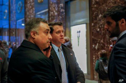 In this Dec. 12, 2016 photo, Los Angeles venture capitalist Imaad Zuberi, far left, arrives at Trump Tower in New York. Zuberi…