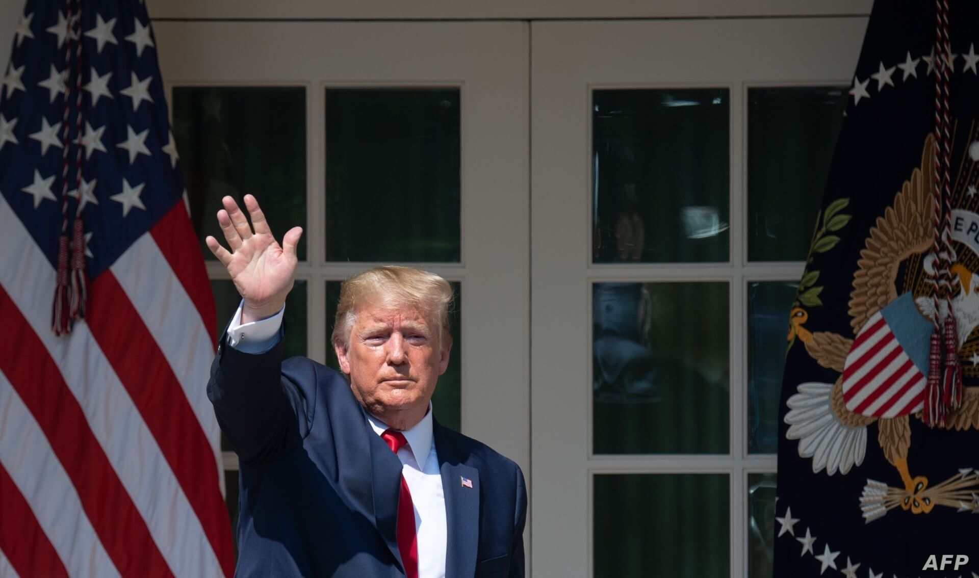 US President Donald Trump waves after signing HR 1327, an act to permanently authorize the September 11th victim compensation fund, during a ceremony in the Rose Garden of the White House in Washington, DC, July 29, 2019. / AFP / SAUL LOEB