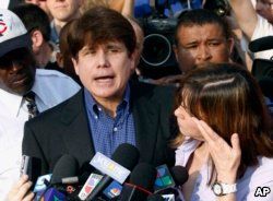 FILE - In this March 14, 2012 file photo, former Illinois Gov. Rod Blagojevich, accompanied by his wife Patti, speaks to the media outside his home in Chicago.