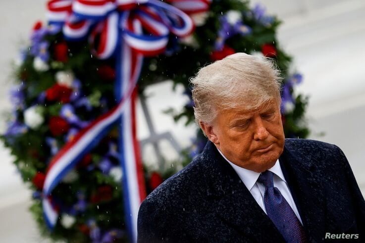 U.S. President Donald Trump departs after placing a wreath at the Tomb of the Unknown Solider on Veterans Day.