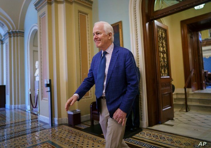 Sen. John Cornyn, R-Texas, departs the Senate chamber after final votes before the Memorial Day recess, at the Capitol in…