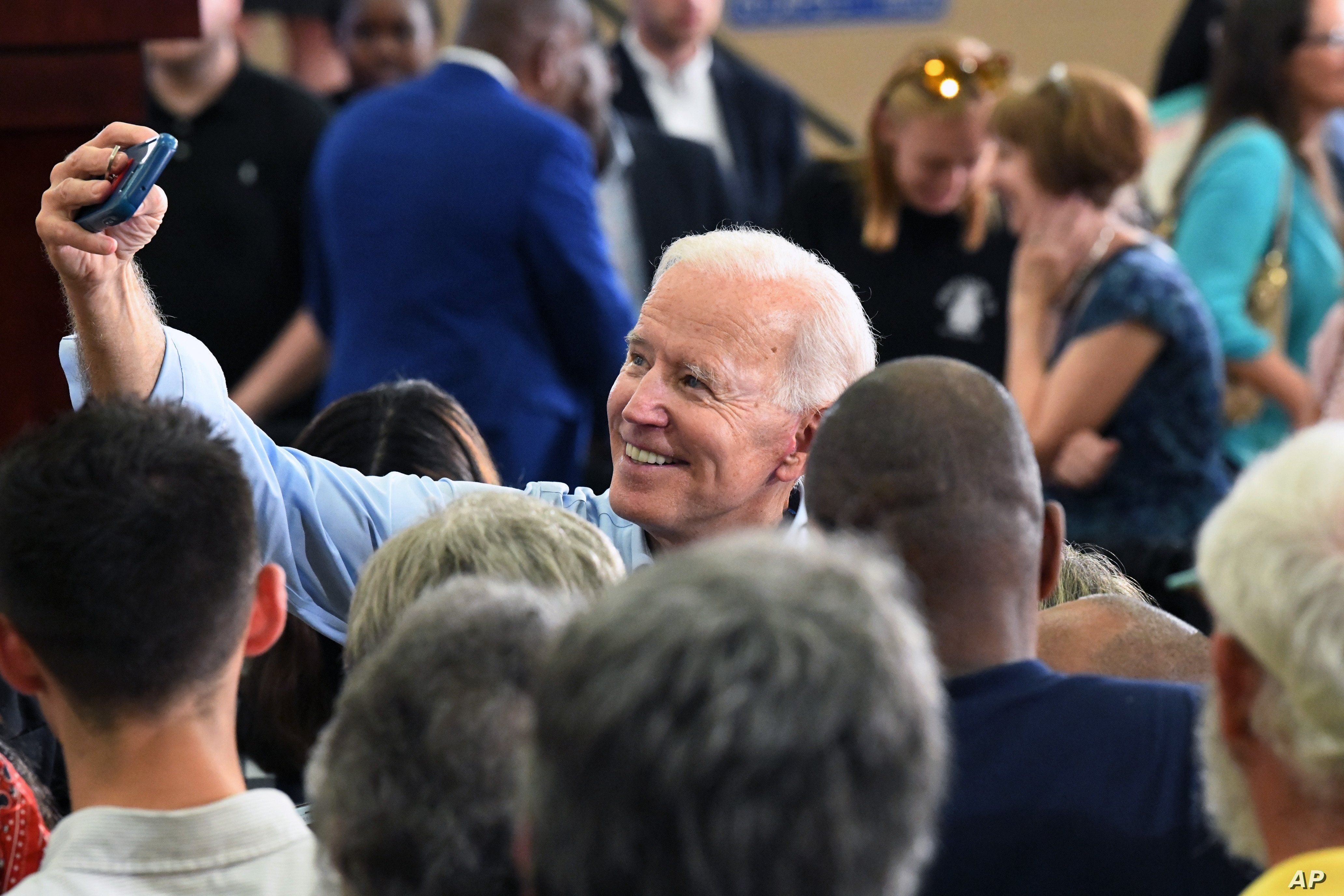 Former Vice President Joe Biden takes photos with supporters following the first rally of his 2020 campaign, May 4, 2019 in Columbia, S.C.