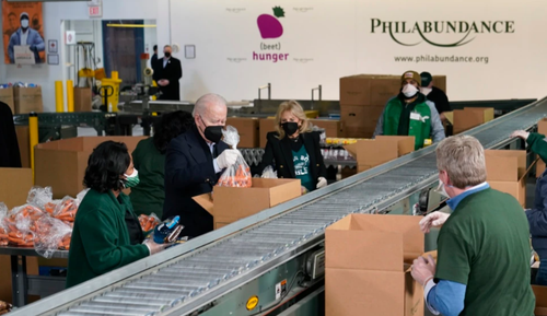 Bidens Pack Carrots, Apples Into Boxes During Food Bank Stop