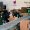 Bidens Pack Carrots, Apples Into Boxes During Food Bank Stop