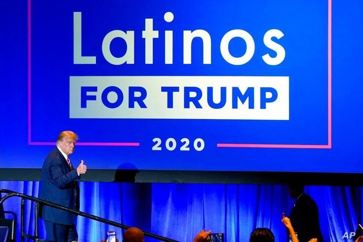 FILE - In this Sept. 14, 2020 file photo, President Donald Trump give a thumbs up to the cheering crowd after a Latinos for…