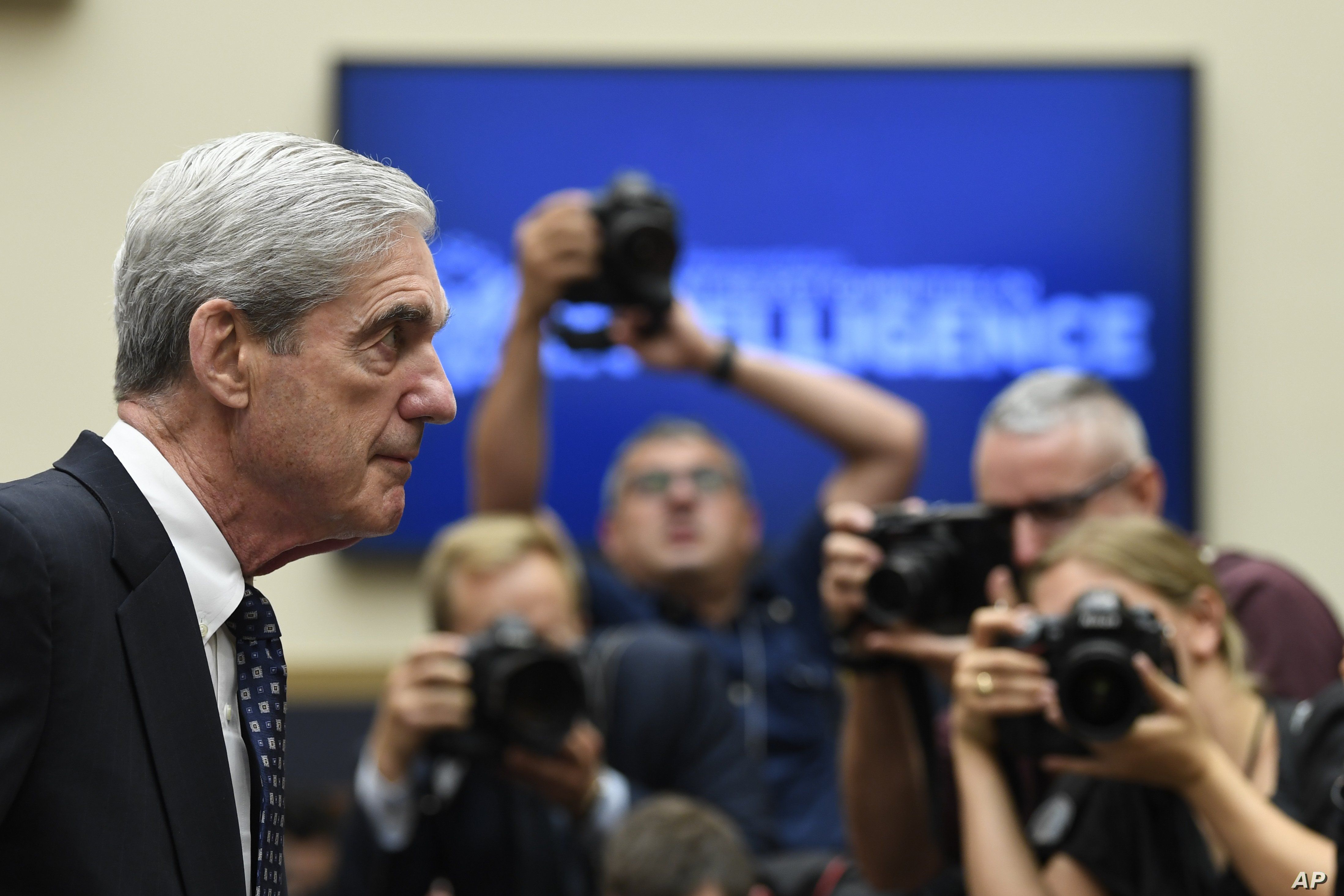 Former special counsel Robert Mueller returns to the witness table following a break in his testimony before the House Intelligence Committee on Capitol Hill, July 24, 2019. 