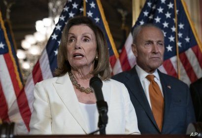 FILE - Speaker of the House Nancy Pelosi, D-Calif., joined at right by Senate Minority Leader Chuck Schumer, D-N.Y., calls for a Senate vote on the House-passed Bipartisan Background Checks Act at the Capitol in Washington, Sept. 9, 2019. 