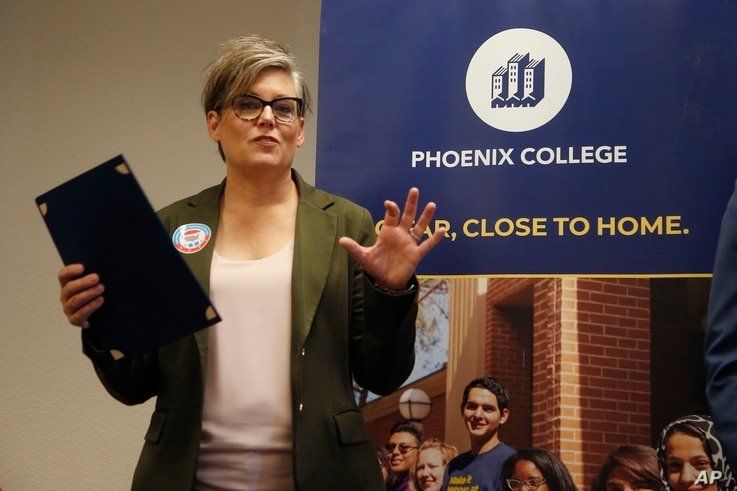 FILE - In this Sept. 24, 2019, file photo, Arizona Secretary of State Katie Hobbs talks about voter registration at Phoenix…