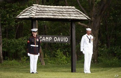 Members of an honor guard stand at attention at Camp David, Md. (file photo).