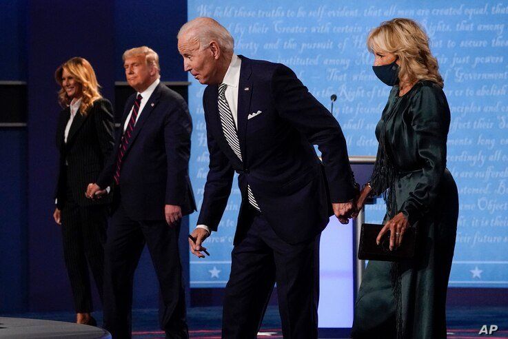 From l-r, first lady Melania Trump, President Donald Trump, Democratic presidential candidate former Vice President Joe Biden…