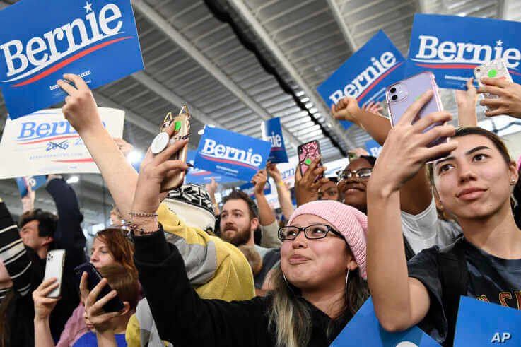 People listen as Democratic presidential candidate Sen. Bernie Sanders, I-Vt., speaks at a campaign rally in Springfield, Va.