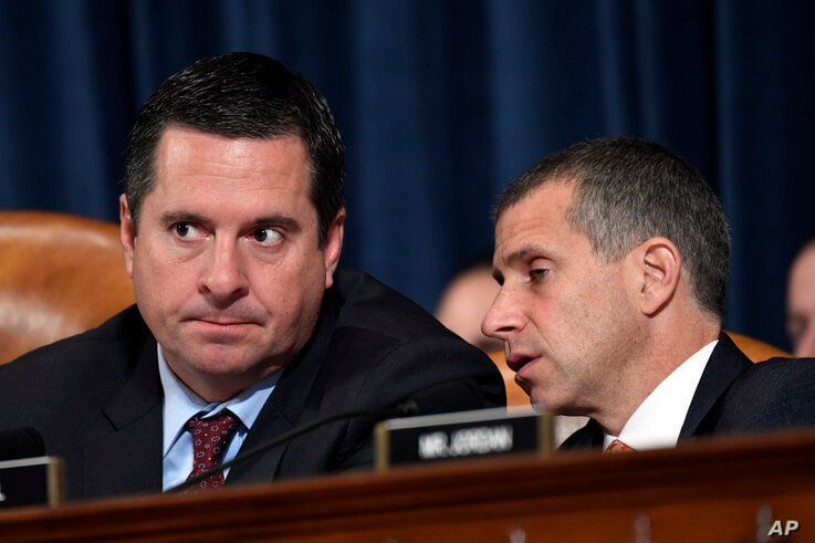 Republican Congressman Devin Nunes, left, talks to Steve Castor, Republican staff attorney, during testimony from former U.S. Ambassador to Ukraine Marie Yovanovitch on Capitol Hill in Washington, Nov. 15, 2019.