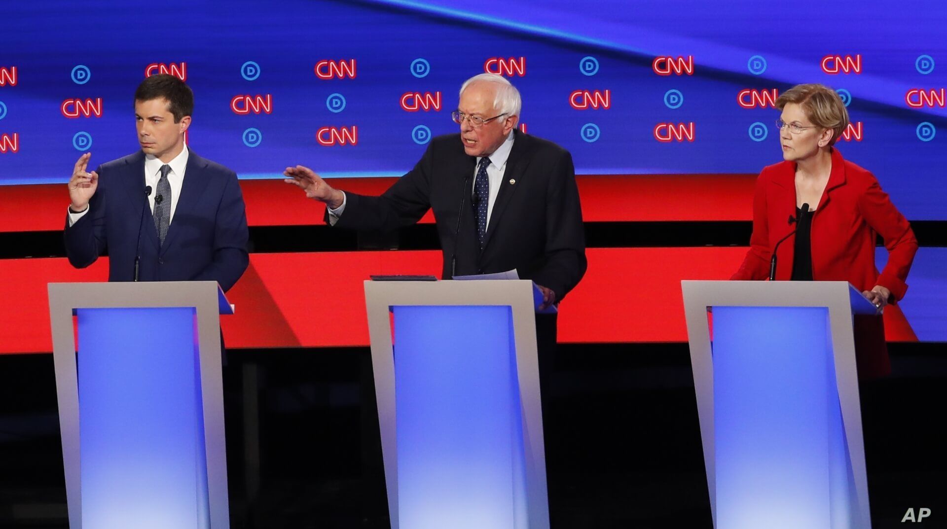 South Bend Mayor Pete Buttigieg, Sen. Bernie Sanders, I-Vt., and Sen. Elizabeth Warren, D-Mass., participate in the first of two Democratic presidential primary debates hosted by CNN Tuesday, July 30, 2019, in the Fox Theatre in Detroit. (AP Photo…