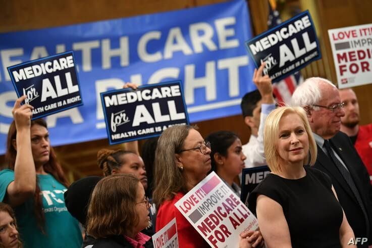 Democratic 2020 presidential hopefuls Sen. Kirsten Gillibrand (D-NY) and Bernie Sanders (I-VT) attend a Medicare For All event on Capitol Hill in Washington, April 10, 2019. 