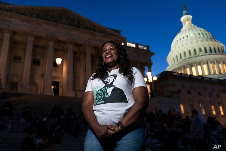 Rep. Cori Bush, D-Mo., speaks with reporters as she camps outside the U.S. Capitol, in Washington, Monday, Aug. 2, 2021, as…