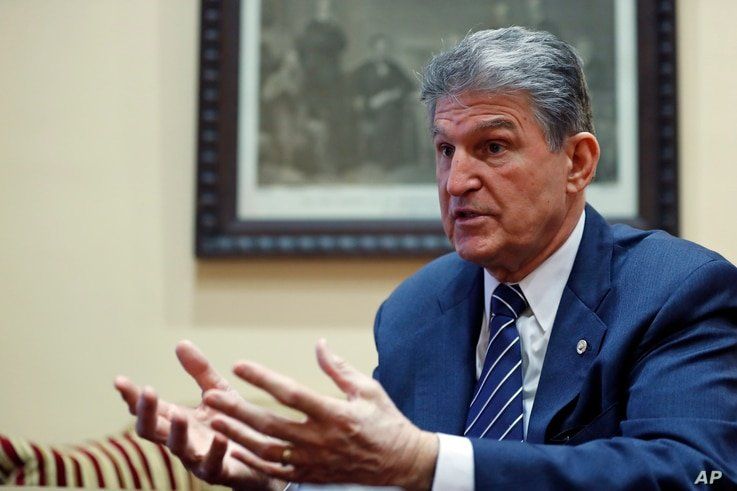 FILE - In this Feb. 1, 2017 file photo, Sen. Joe Manchin, D-W.Va. is interviewed by The Associated Press in his office in Washington.