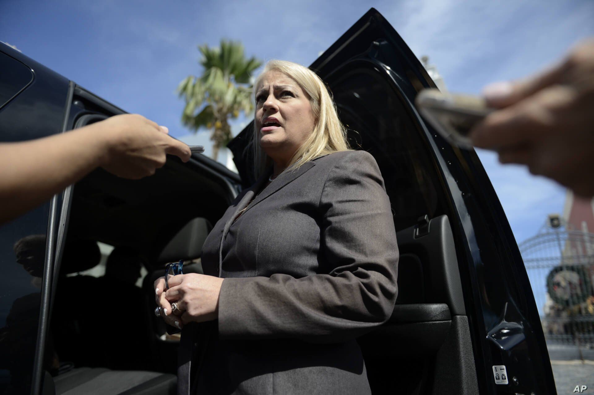 FILE - Puerto Rico Justice Secretary Wanda Vazquez answers reporters' questions, in San Juan, Puerto Rico, Jan. 16, 2018. 