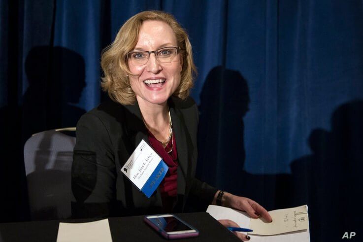 Michigan Supreme Court Justice Joan Larsen prepares to leave the stage after moderating a panel discussion during the…