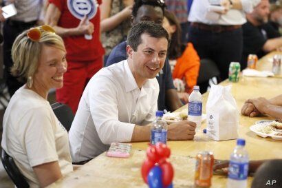 Democratic presidential candidate Pete Buttigieg speaks with local residents at the Hawkeye Area Labor Council Labor Day Picnic in Cedar Rapids, Iowa, Sept. 2, 2019.