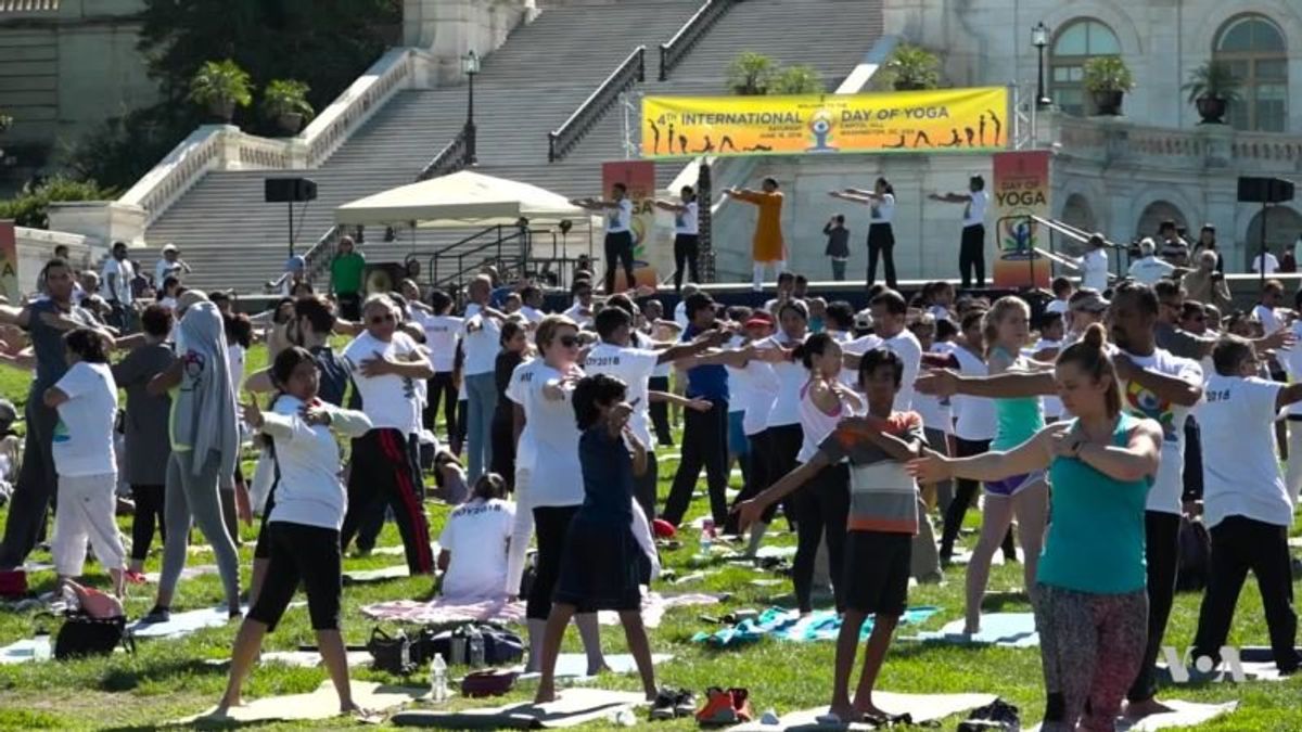 Yoga Practitioners Bring Mats to the Lawn of US Capitol