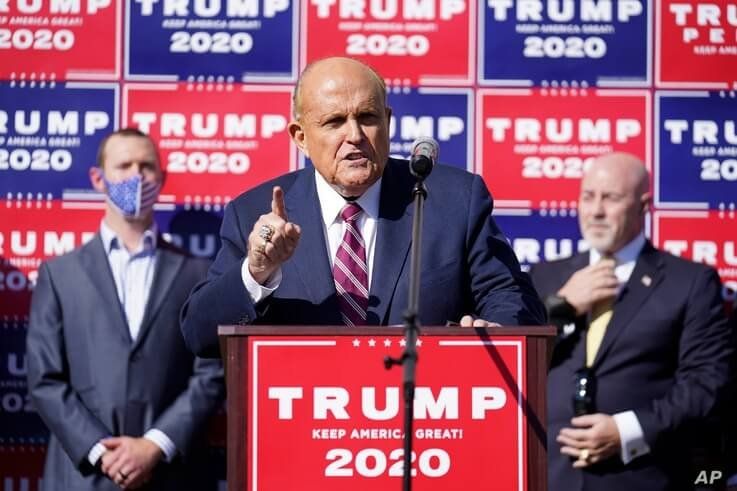Former New York mayor Rudy Giuliani, a lawyer for President Donald Trump, speaks during a news conference on legal challenges…