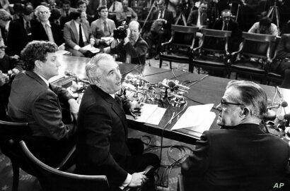 Chairman Peter Rodino, D-N.J., of the U.S. House of Representatives Judiciary Committee,center, chief counsel John Doar, left, and minority counsel Albert Jenner, right, gather for a news conference in Washington,  March 5, 1974.  Doar presented a st