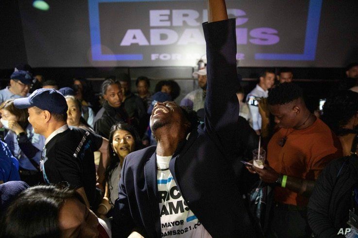 Supporters cheer during an election party for New York mayoral candidate Eric Adams, late Tuesday, June 22, 2021, in New York. …