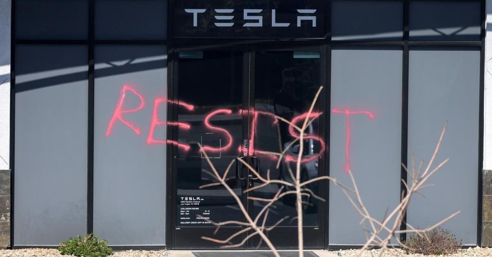 Justice Department charges three people over alleged Tesla vandalism, arson