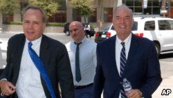 Expelled Arizona House Rep. Don Shooter, right, arrives at court with attorney Tim Nelson, left, June 14, 2018, in Phoenix. 